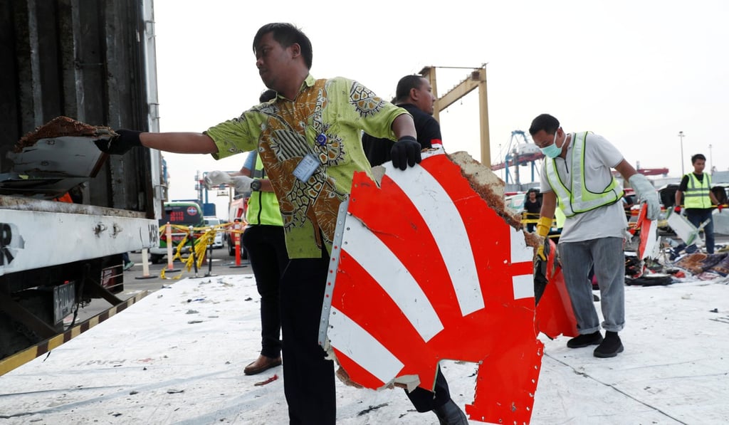 A 2018 file photo of workers loading up recovered debris and belongings believed to be from Lion Air flight JT610 onto a truck at Tanjung Priok port in Jakarta, Indonesia. Photo: Reuters/Edgar Su