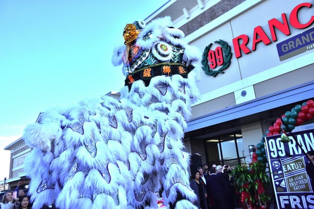 A dragon dances at the grand opening of a 99 Ranch Market.