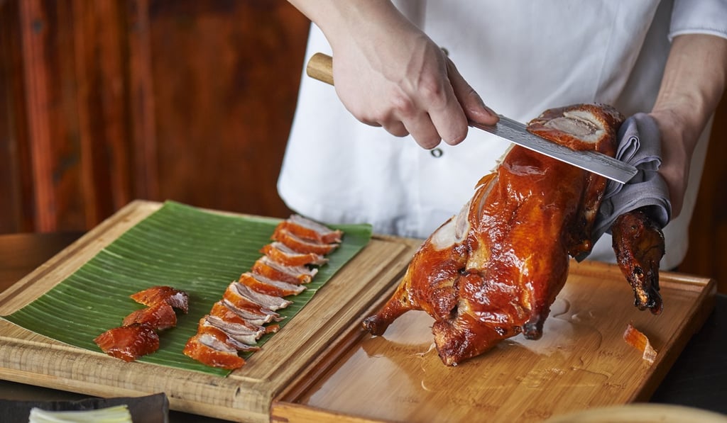Carving Peking Duck tableside at Hutong Carving Peking Duck tableside at Hutong