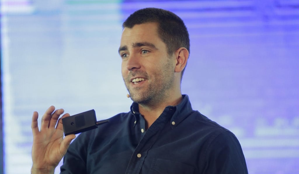 Chris Cox speaking at an event in Lagos, Nigeria. Photo: AP