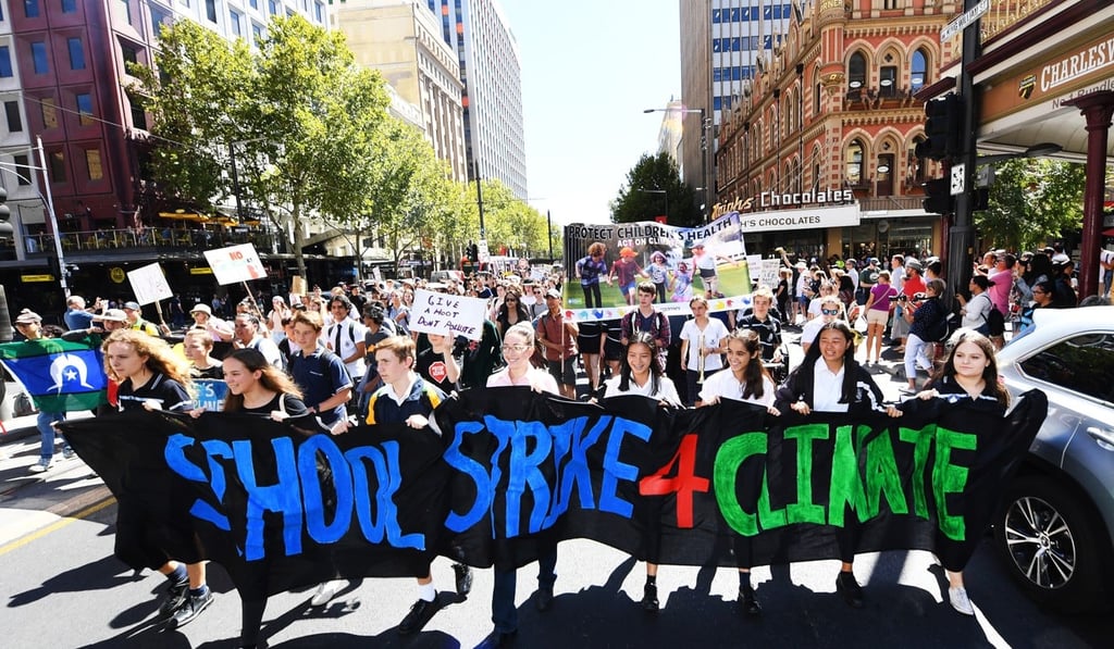 Schoolchildren march through Adelaide demanding urgent political action on climate change. Photo: EPA