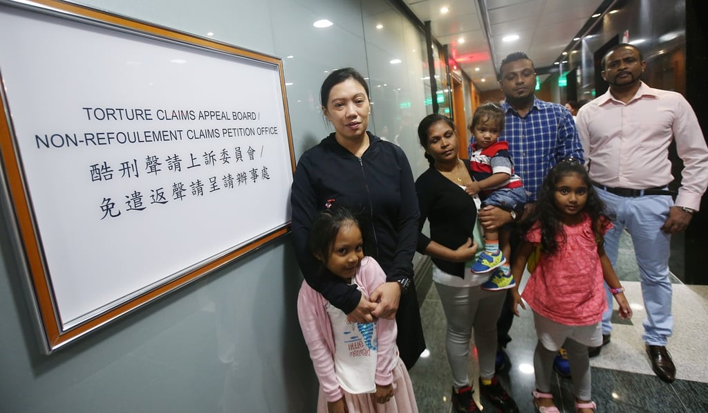 Asylum seekers who helped shelter whistle-blower Edward Snowden in 2013 appear at the Torture Claim Appeal Board and Non-refoulement Claims Petition Office in 2017. Their asylum claims were rejected by the Hong Kong government. Photo: David Wong