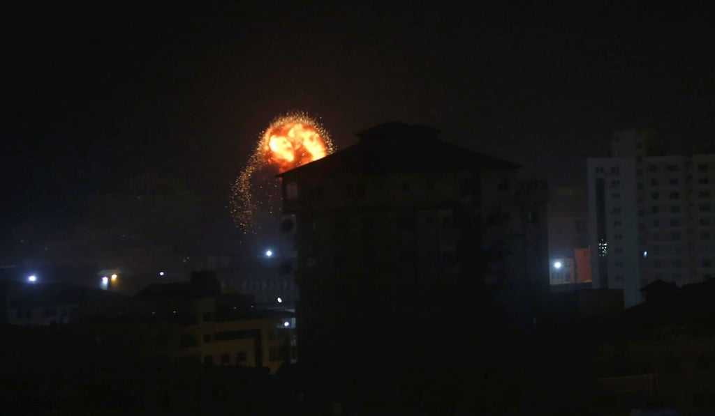 An explosion caused by Israeli airstrikes is seen in Gaza City, early Friday. Photo: AP Photo