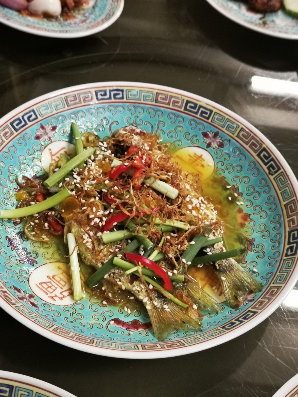 Assam fish – one of the dishes using Chinese ingredients mixed with distinct Malay spices or cooking methods, served at the family-run The Little Kitchen @ Nyonya in George Town, Penang.