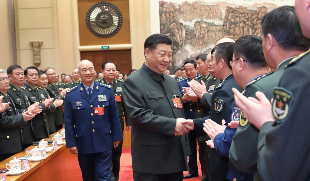 Chinese President Xi Jinping, who is also general secretary of the Chinese Communist Party’s Central Committee and chairman of the Central Military Commission, meets deputies from the People's Liberation Army and armed police before attending a plenary meeting at the National People’s Congress in Beijing on Tuesday. Photo: Xinhua