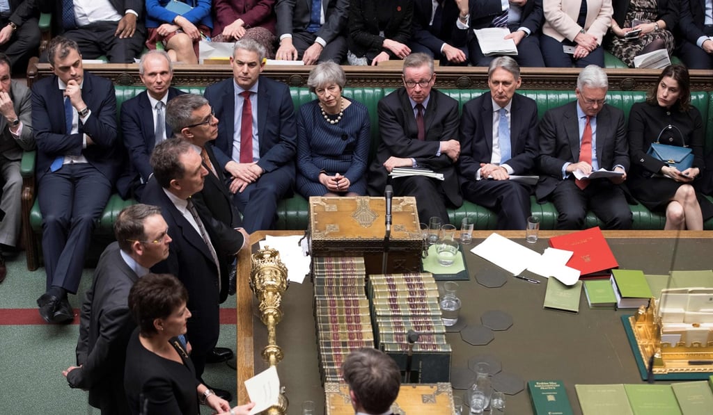 Britain’s Prime Minister Theresa May (centre) watching as tellers announce a votes tally in the House of Commons. Photo: AFP
