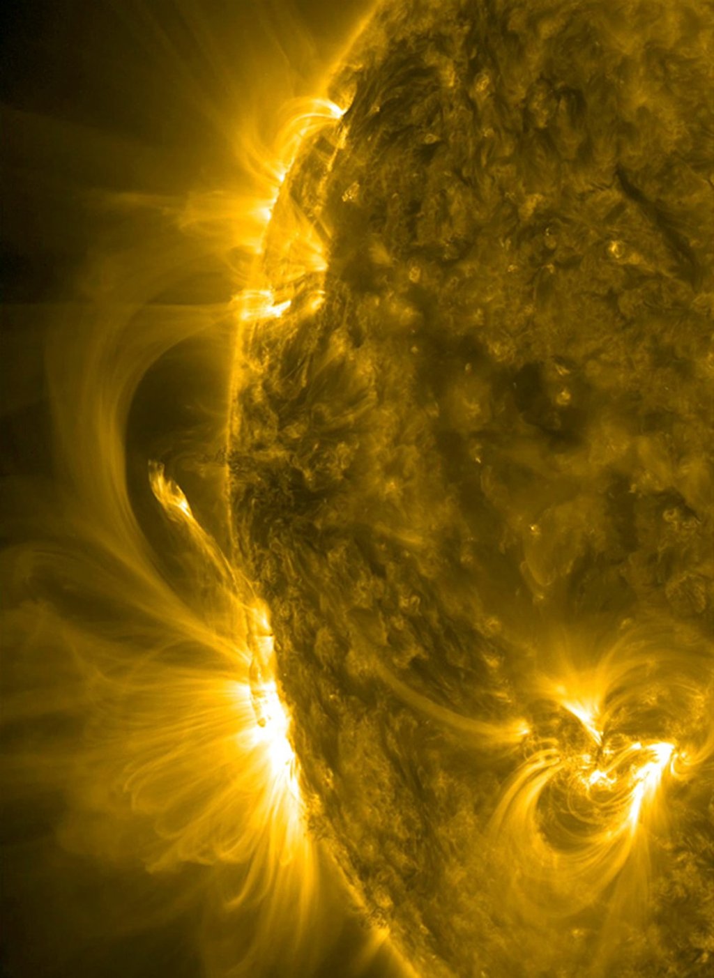 This July 2012 image taken from video provided by Nasa’s Solar Dynamics Observatory shows ribbons of plasma and magnetic lines bursting from the sun. Photo: AP/Solar Dynamics Observatory/Nasa