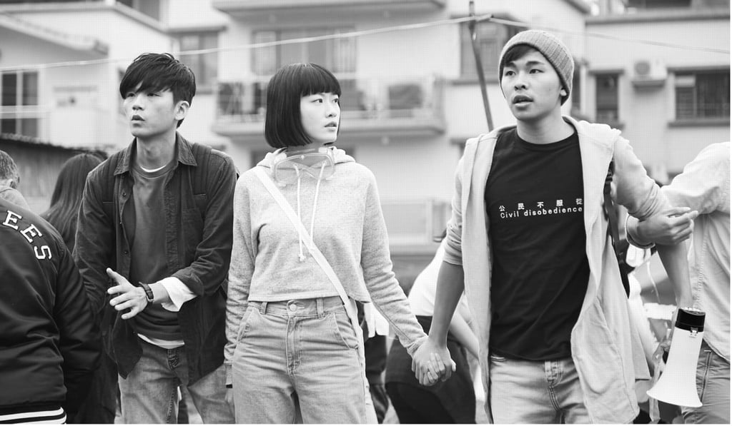 Fish Liew (centre) in a still from No. 1 Chung Ying Street (2018).