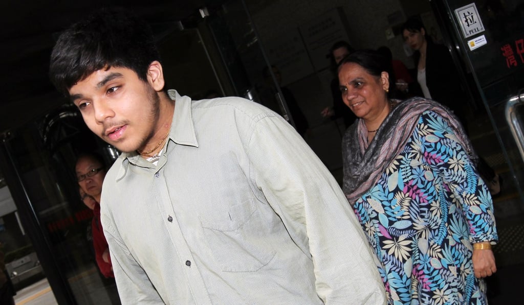Arjun Singh (left) and his mother walk out of the District Court in Wan Chai in April 2007. They sued the Hong Kong government and a police officer over the handling of a complaint of assault against Singh. Photo: Dickson Lee