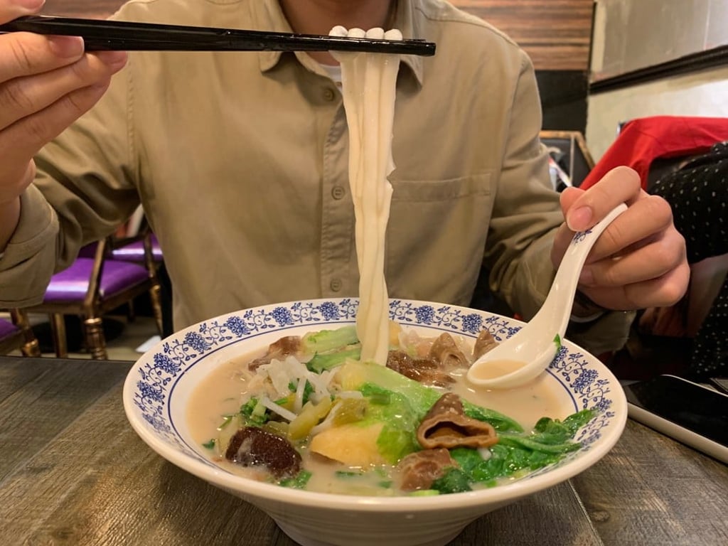 Pork bone broth (not spicy) with potato noodles, pork intestine, beef tendon, fish dumplings, tofu puffs and Chinese lettuce. Photo: Simone McCarthy