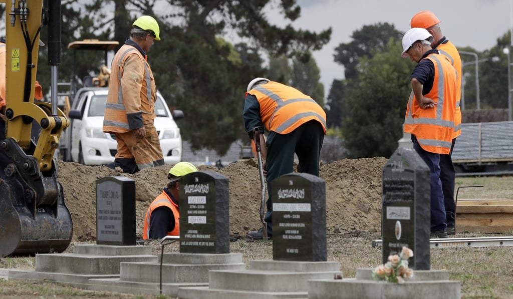 Workers dig graves at a Muslim cemetery in Christchurch. Photo: AP