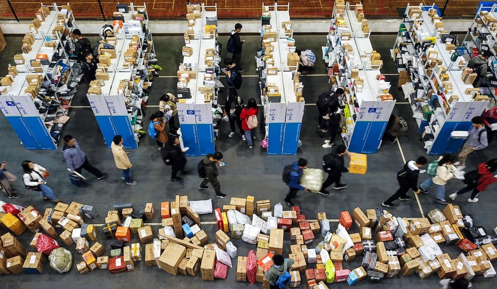 Staff and students pick up their parcels at a makeshift collection point at Nanjing University of Aeronautics and Astronautics, in Nanjing in east China’s Jiangsu province, on November 13, 2018. The number of online shoppers in China had hit 610 million by December 2018, up 14.4 per cent year on year. Photo: Xinhua