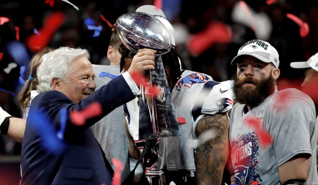 New England Patriots' Julian Eddleman (R) and New England Patriots owner Robert Kraft celebrate with the Vince Lombardi trophy after winning the Super Bowl LIII. Photo: Reuters
