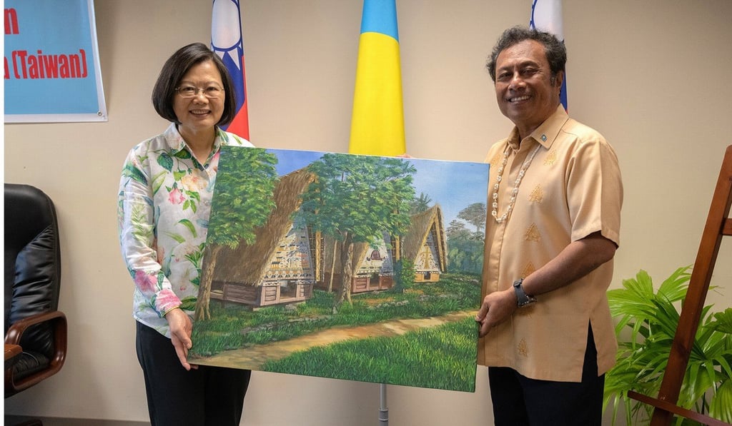 Taiwanese President Tsai Ing-wen receives a painting from Palau’s President Tommy Remengesau during the first leg of her visit to three Pacific island states. Photo: EPA-EFE