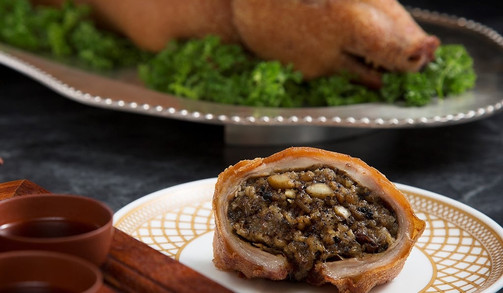 Roast suckling pig stuffed with pearl barley, black truffle, glutinous rice and Yunnan ham