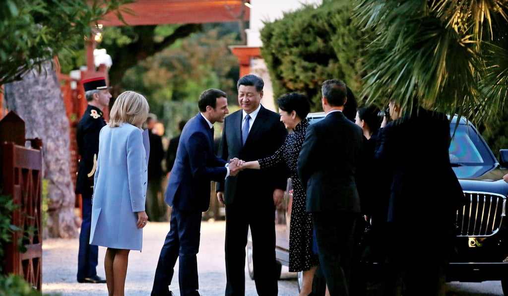 Macron greeting Xi and his wife as they arrived at Beaulieu-sur-Mer on Sunday. Photo: EPA-EFE Macron greeting Xi and his wife as they arrived at Beaulieu-sur-Mer on Sunday. Photo: EPA-EFE