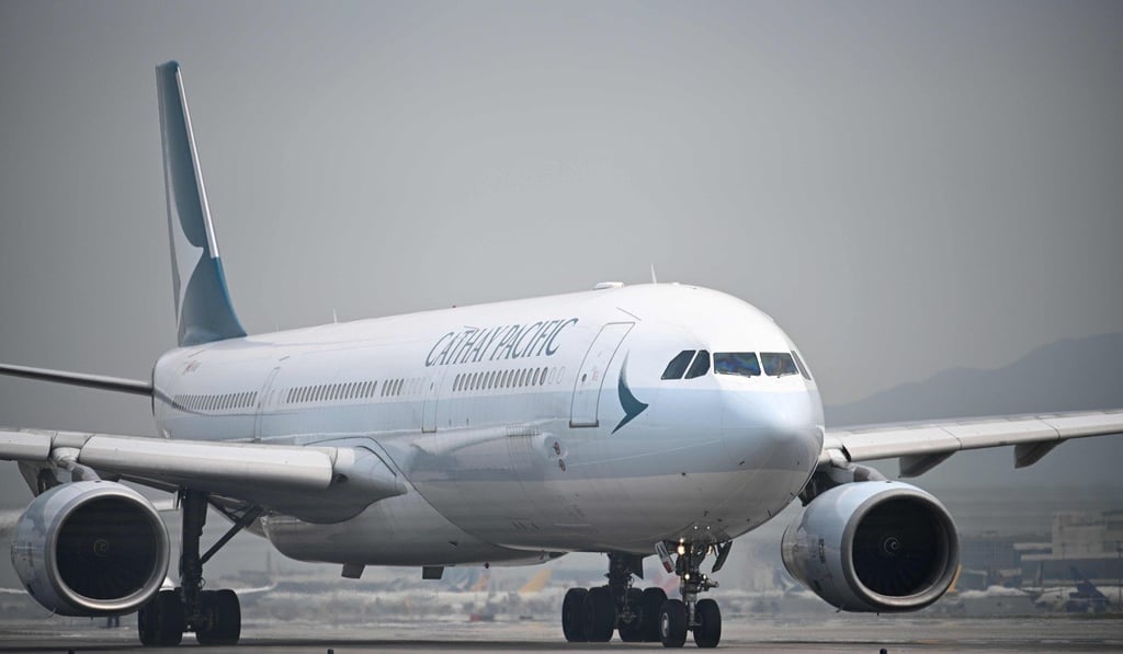 Cathay has resisted mounting pressure to provide a full explanation after a pilot was taken to hospital to be treated for measles. Photo: AFP