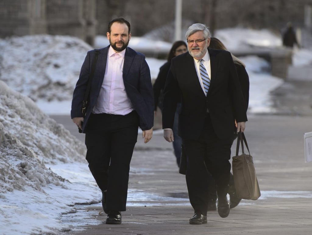 Joshua Boyle and his father Patrick Boyle arrive to court in Ottawa on Monday to face charges that he repeatedly assaulted his wife. Boyle and his wife were taken hostage in 2012 by a Taliban-linked group while on a backpacking trip in Afghanistan. Photo: AP