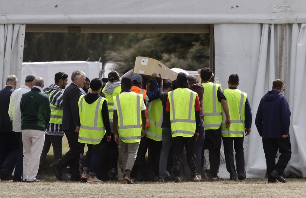 Mourners carry the body of a victim of the Christchurch mosque shootings for a burial at the Memorial Park Cemetery in Christchurch last Wednesday. Photo: AP