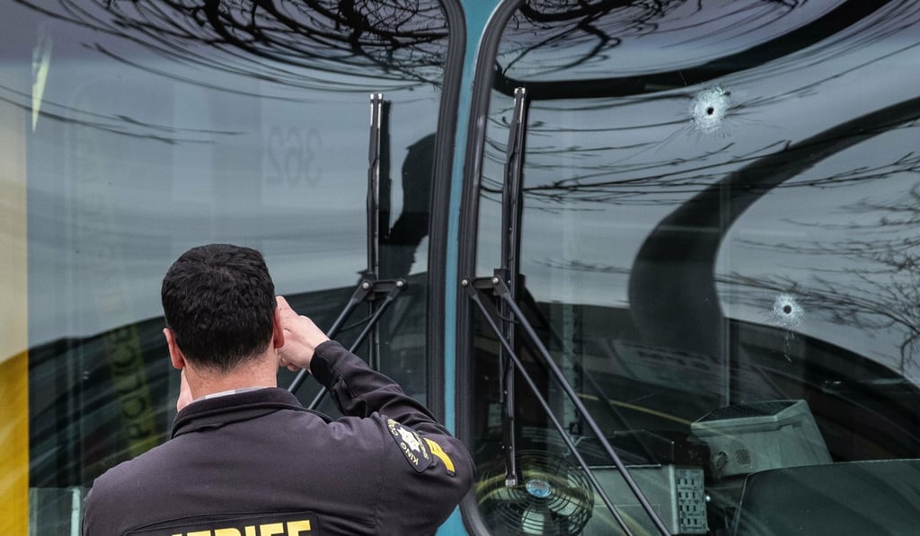 Several bullet holes can be seen in the driver's side window of a Metro Bus on Northeast 125th Street. Photo: The Seattle Times via AP