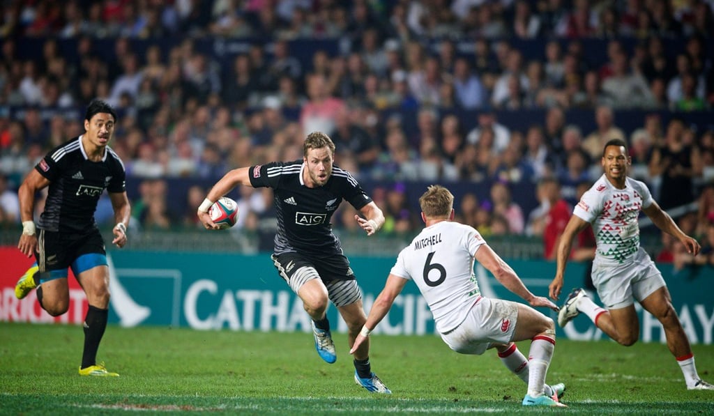 Tim Mikkelson (second left), co-captain of the All Blacks Sevens team, on the attack during a previous tournament. Photo: Shutterstock
