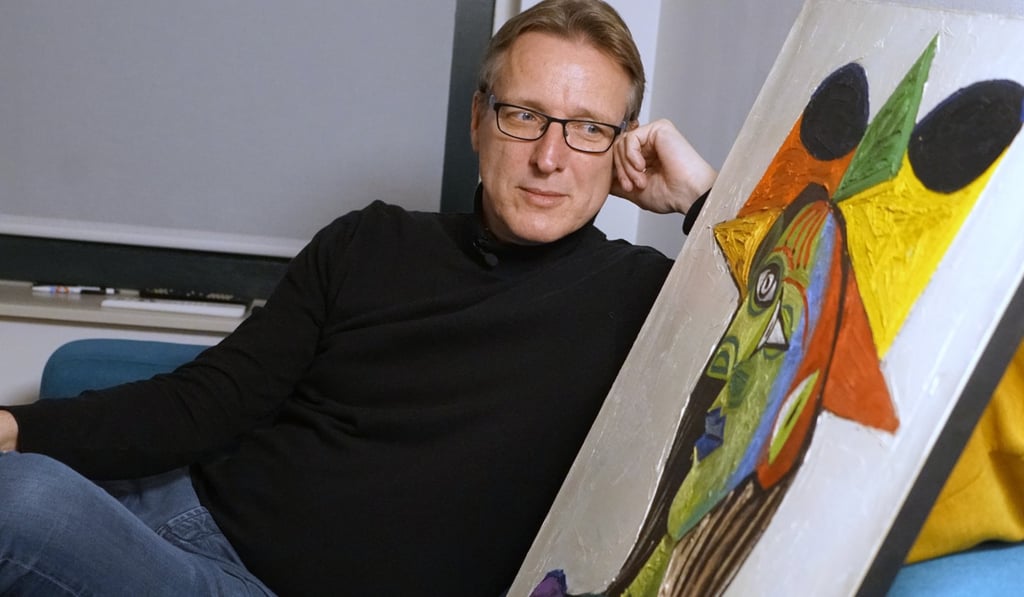 Art historian Arthur Brand with the recovered Picasso painting. Photo: AP