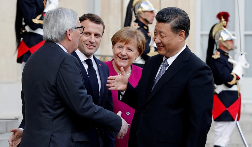 European Commission President Jean-Claude Juncker (left), French President Emmanuel Macron and German Chancellor Angela Merkel welcome Chinese President Xi Jinping at the Elysee Palace in Paris, on Tuesday. Photo: Reuters