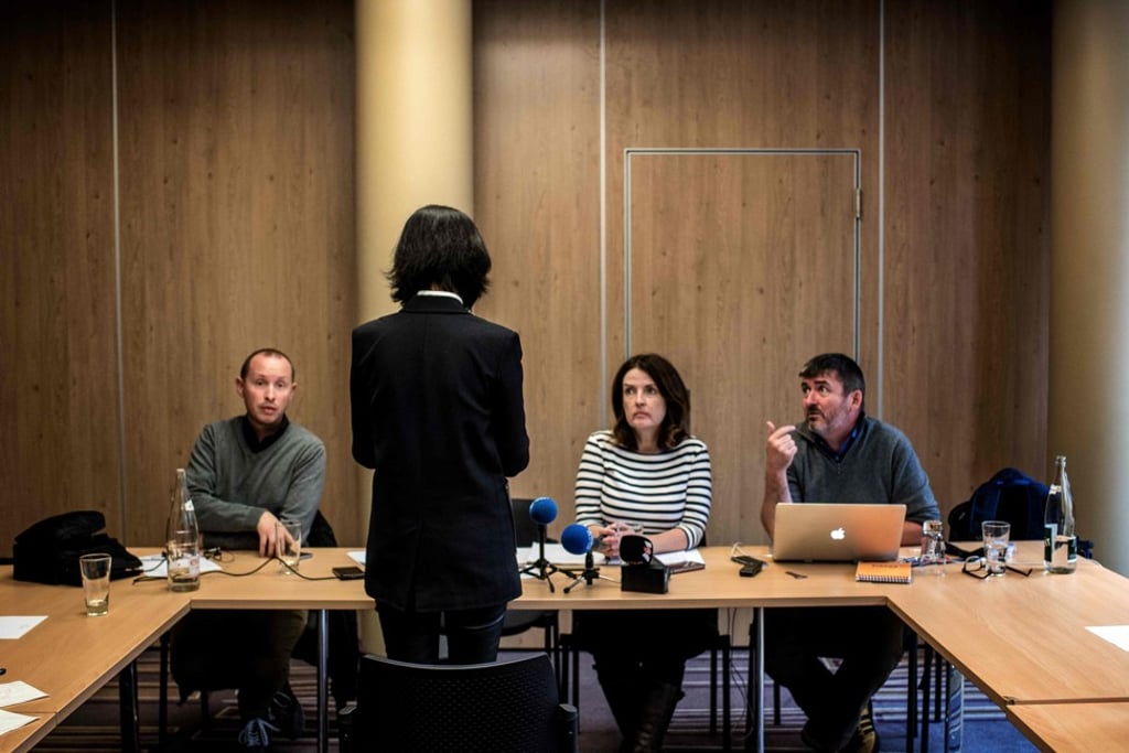 Grace Meng (back to camera), the wife of Meng Hongwei, talks to journalists on October 7, 2018 in Lyon, France. Photo: AFP