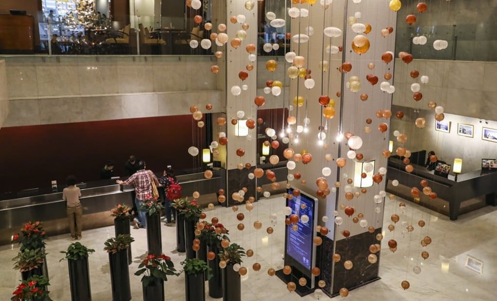 The lobby of The Excelsior on 20 February 2019. On the final night of its 46 years, the lobby recreated the set of Revenge of the Pink Panther, the 1978 comedy that was filmed here. After the final guest checks out on Sunday, March 31, the staff will have the hotel all to themselves for a few hours. The reception desk will turn into a bar, and the concierge desk will become a DJ station. Photo: SCMP / K. Y. Cheng