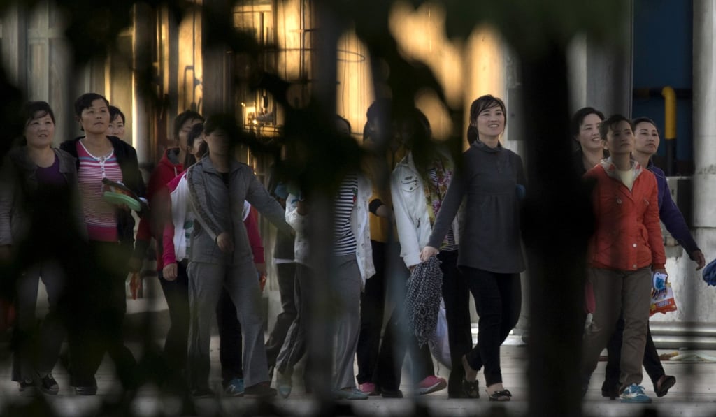 North Korean workers pictured in the compound of a seafood processing factory in northeast China’s Jilin province in 2017. Photo: AP