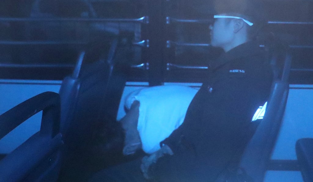 Amina Bokhary is escorted from Eastern Court on March 18. Photo: Sam Tsang