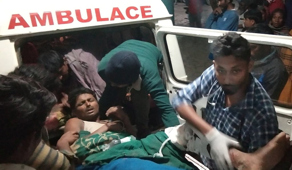 A victim of a thunderstorm is carried out from an ambulance. Photo: Reuters