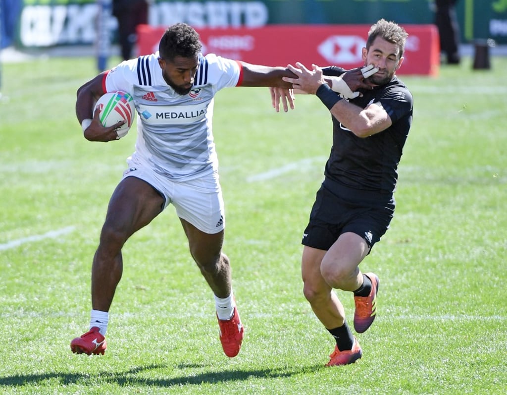 USA’s Matai Leuta avoids a tackle from Kurt Baker on his way to securing the win in Las Vegas for the US. Photo: AFP