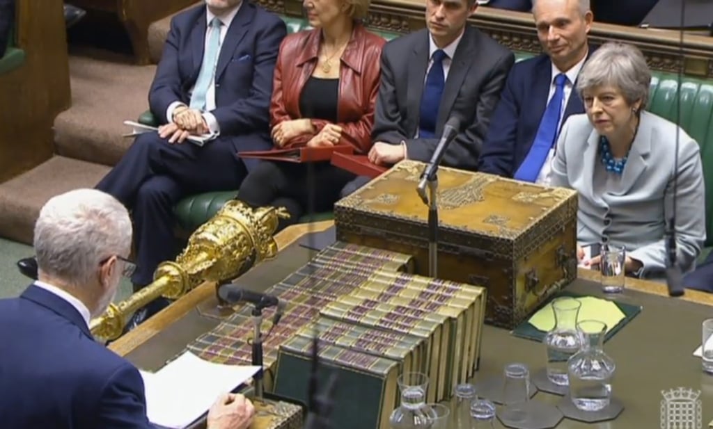 British opposition leader Jeremy Corbyn (left) replies to British Prime Minister Theresa May after her statement on Brexit to the British House of Commons on March 25. Photo: EPA