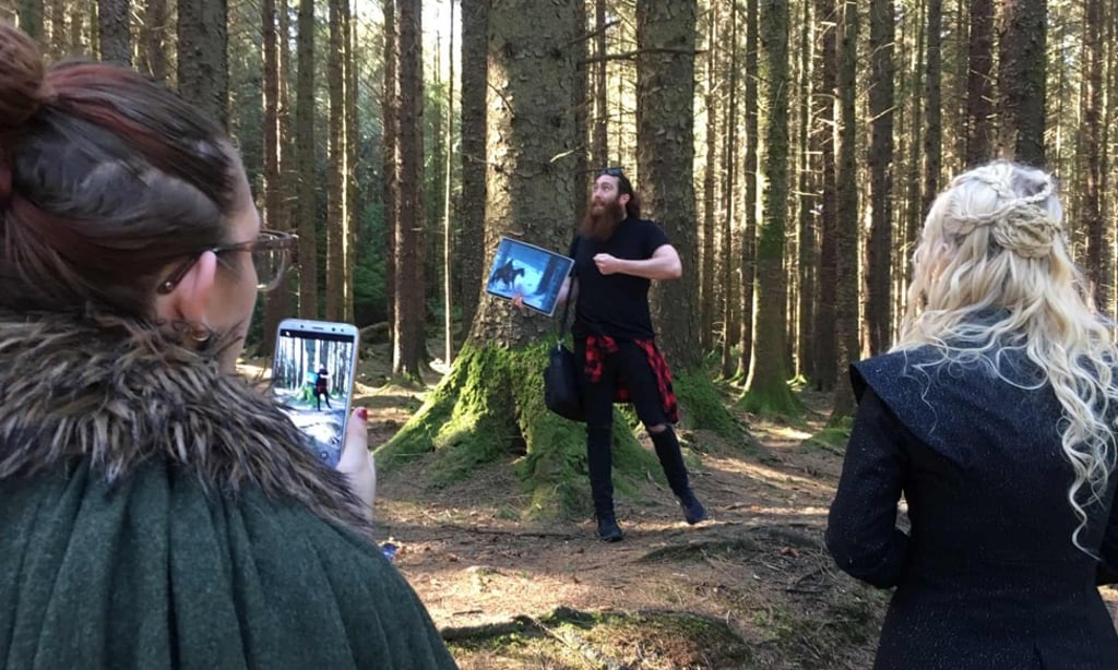 Guide Eric Nolan (centre), shows a group of tourists ‘Game of Thrones’ filming locations in Tollymore Forest, Northern Ireland. Photo: The Guardian Guide Eric Nolan (centre), shows a group of tourists ‘Game of Thrones’ filming locations in Tollymore Forest, Northern Ireland. Photo: The Guardian