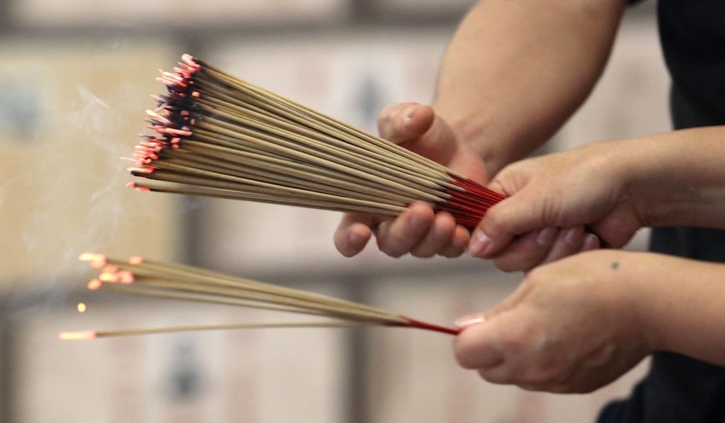 Burning joss sticks is a traditional Ching Ming activity. Photo: Felix Wong