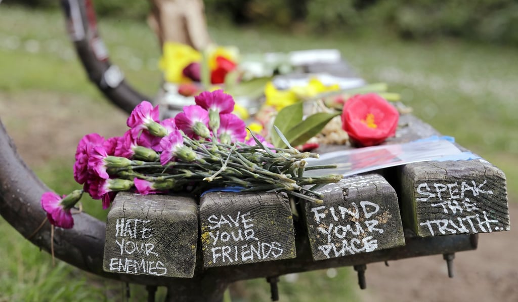 Flowers honouring the late Kurt Cobain on a park bench in Seattle on April 5, 2019. Photo: AP