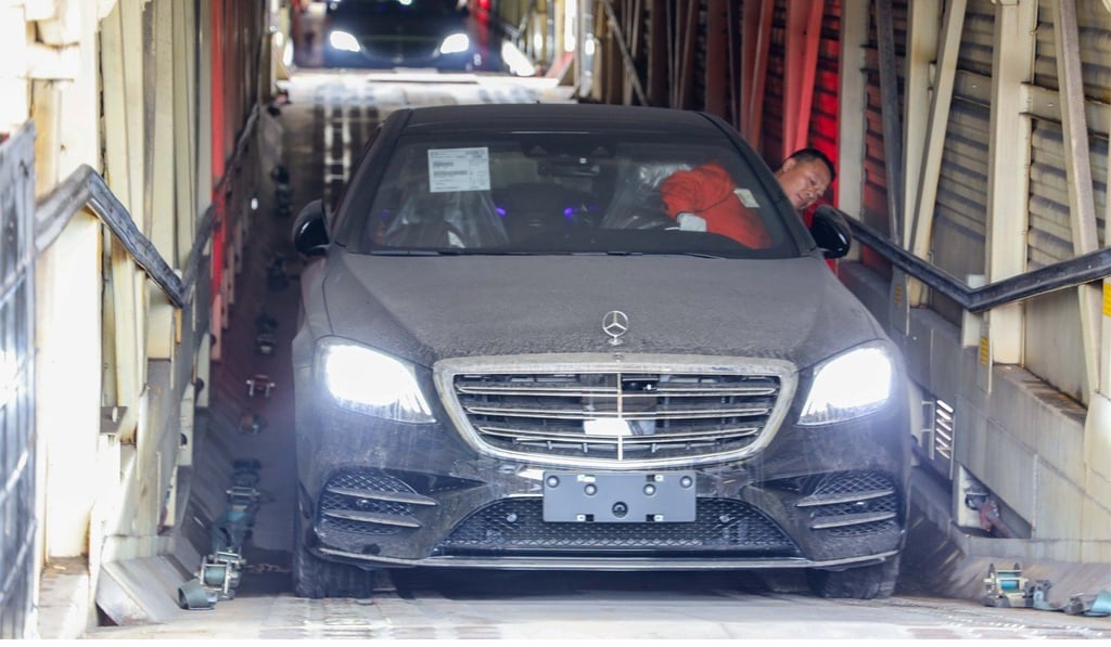 A Mercedes-Benz car is unloaded from the carriage of a China-Europe goods train in Chongqing, southwest China. Photo: Xinhua