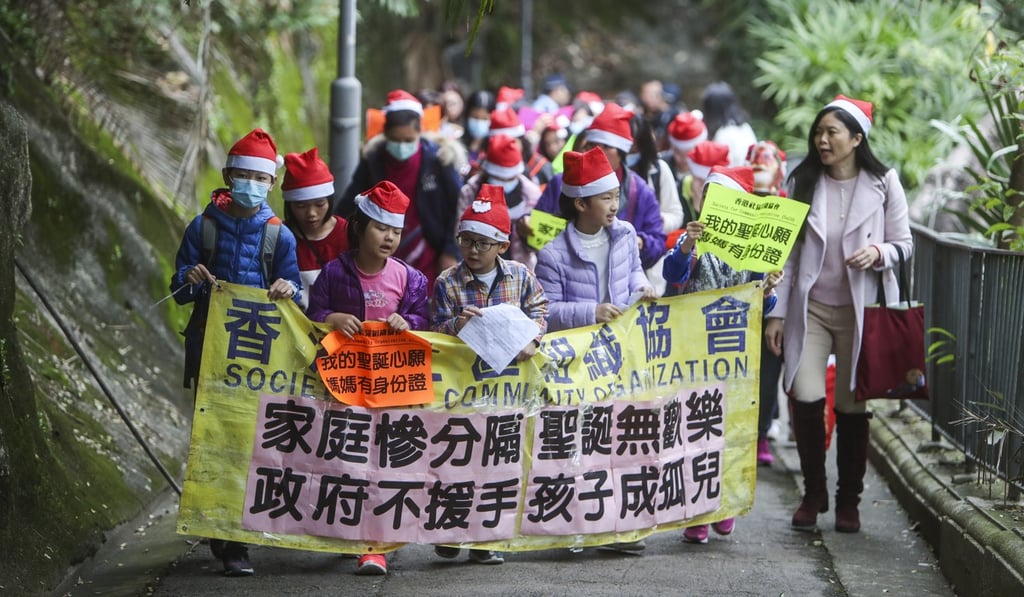 The NGO Society for Community Organisation leads a march of mainland women and their children born in Hong Kong, on December 25 last year, to call for the quicker issuance of one-way permits for mothers to move to Hong Kong. Photo: Winson Wong