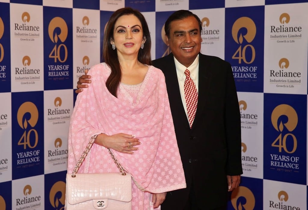 Mukesh Ambani, Chairman and Managing Director of Reliance Industries, poses with wife Nita Ambani before addressing the company's annual general meeting in Mumbai on July 21, 2017. Photo: REUTERS