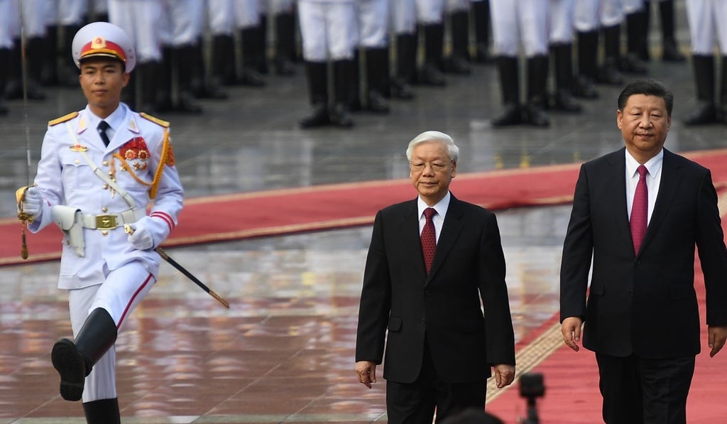 Chinese president Xi Jinping and Vietnamese Communist Party Secretary General Nguyen Phu Trong review an honour guard during a welcoming ceremony at the presidential palace in Hanoi. Photo: AFP