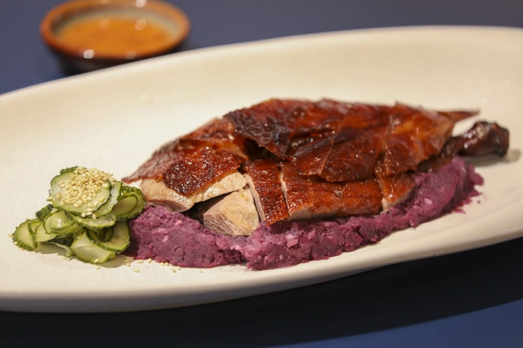 Roast goose with dark-roasted purple plum sauce at John Anthony. Photo: Antony Dickson