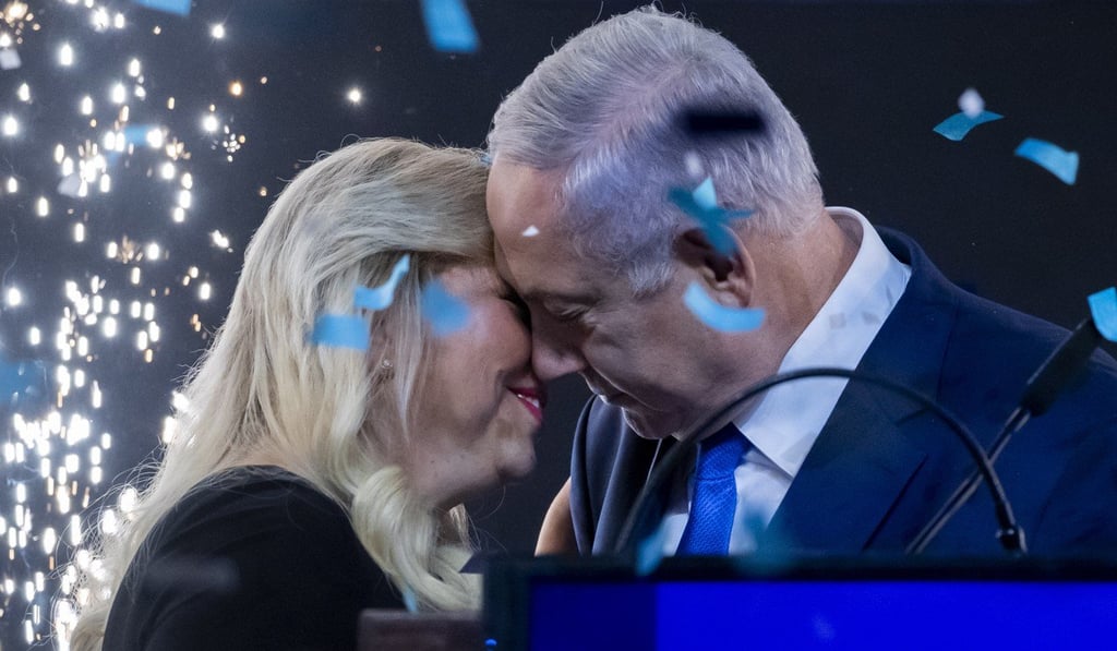 Fireworks flare behind Israel's Prime Minister Benjamin Netanyahu as his wife Sara applauds and kisses him. ‘He’s a magician,’ the crowd chanted. Photo: EPA Fireworks flare behind Israel's Prime Minister Benjamin Netanyahu as his wife Sara applauds and kisses him. ‘He’s a magician,’ the crowd chanted. Photo: EPA