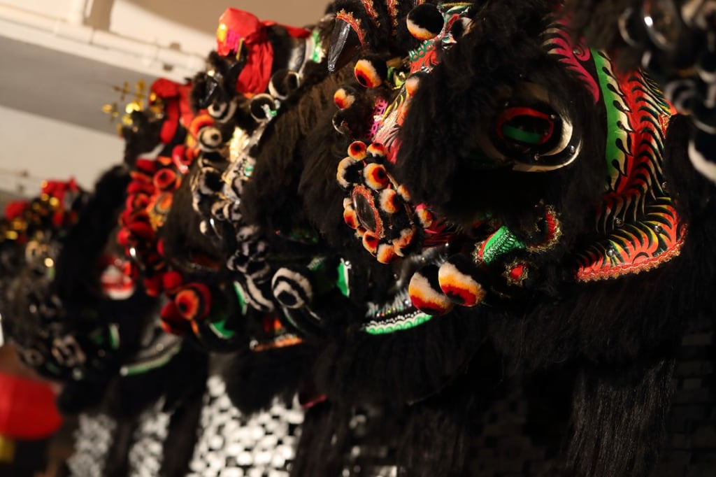 Lion heads on the wall of Dragon Noodles Academy. Photo: Alex Chan