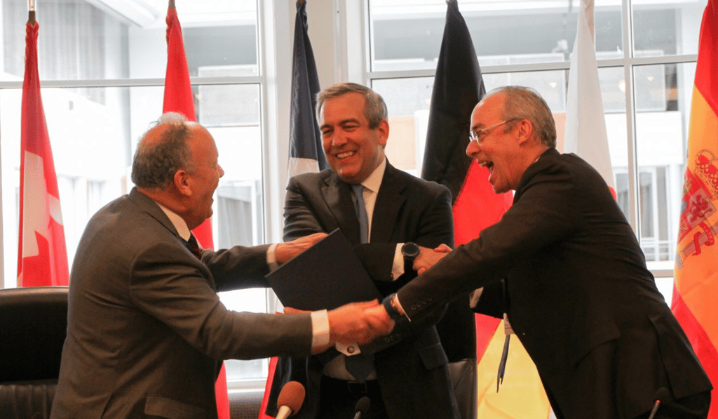 From left, Nanno Kleiterp of the European Development Finance Institutions, David Bohigian of OPIC and Paul Lamontagne of FinDev Canada after signing a memorandum of understanding at OPIC offices in Washington on Thursday. Photo: Handout