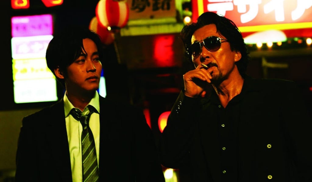 Yakusho (right) and Tori Matsuzaka in a scene from The Blood of Wolves. Yakusho (right) and Tori Matsuzaka in a scene from The Blood of Wolves.