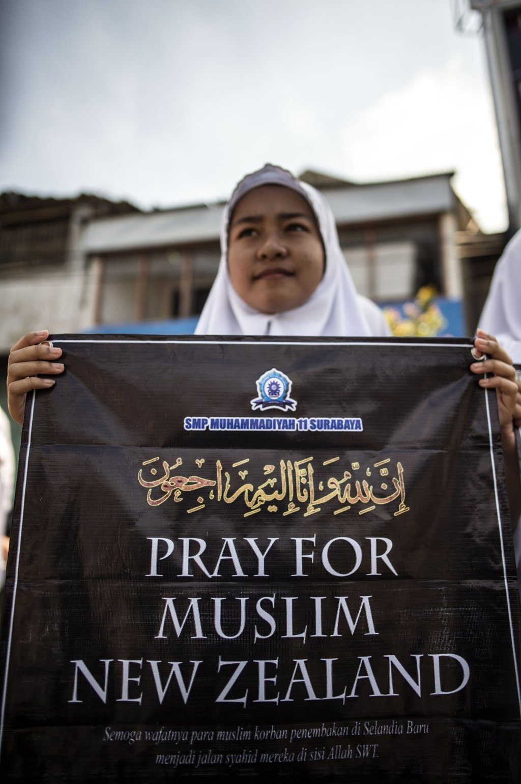 An Indonesian student displays a banner during an event to show solidarity with Muslims in New Zealand. Photo: AFP An Indonesian student displays a banner during an event to show solidarity with Muslims in New Zealand. Photo: AFP