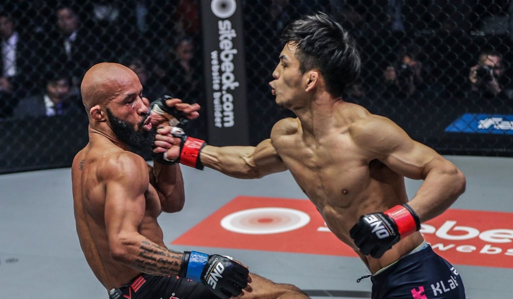 Demetrious Johnson takes a punch from Yuya Wakamatsu.