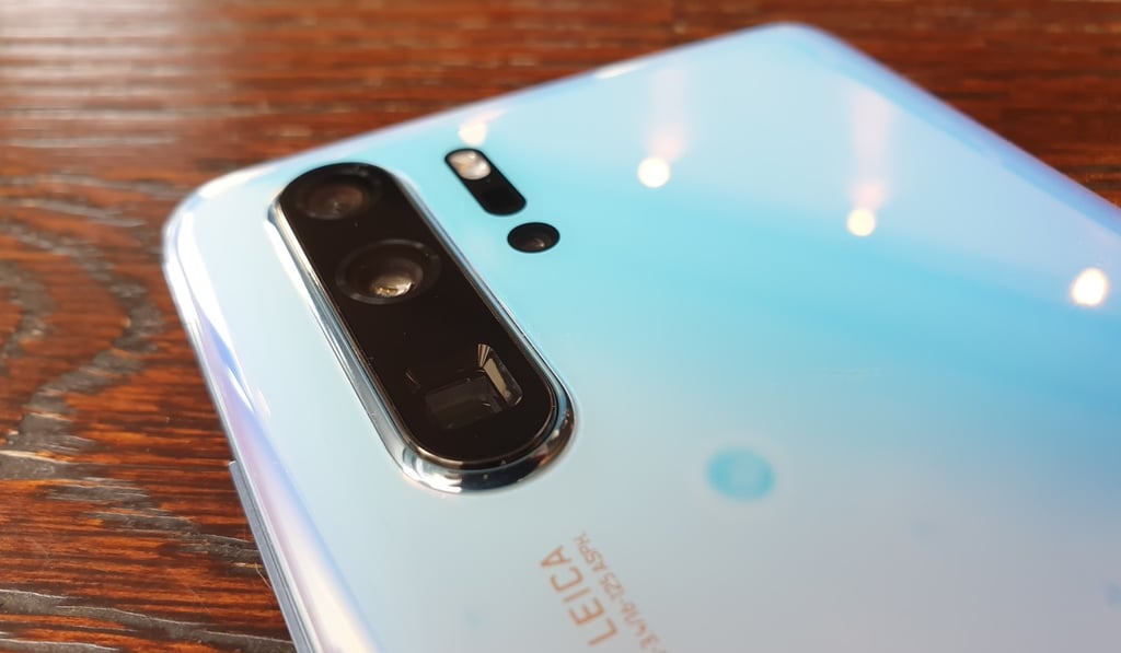 The Huawei P30 Pro has a cutting-edge quad camera array that includes a main 40-megapixel RYYB sensor (top); 20-megapixel wide-angle lens (middle); and 8-megapixel “periscope” telephoto lens (the square lens at the bottom). Photo: Ben Sin The Huawei P30 Pro has a cutting-edge quad camera array that includes a main 40-megapixel RYYB sensor (top); 20-megapixel wide-angle lens (middle); and 8-megapixel “periscope” telephoto lens (the square lens at the bottom). Photo: Ben Sin