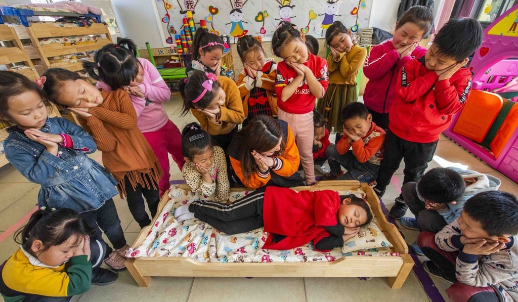 Kindergarten pupils in Qingzhou, Shandong province get a lesson on healthy sleeping positions. Photo: VCG